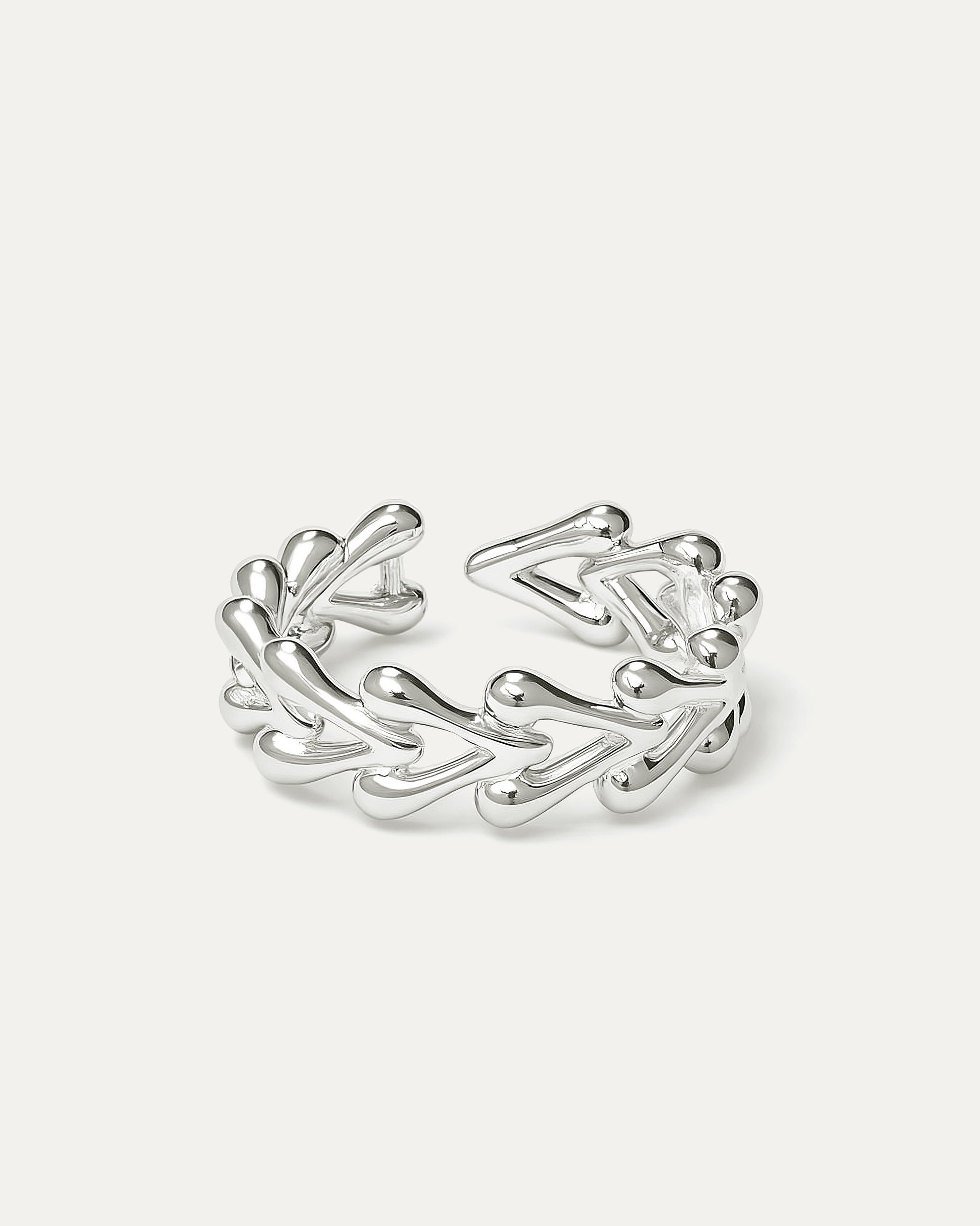delicate silver ring with teardrop vine design on white background
