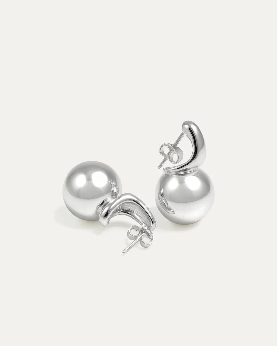 Pair of silver earrings on a white background