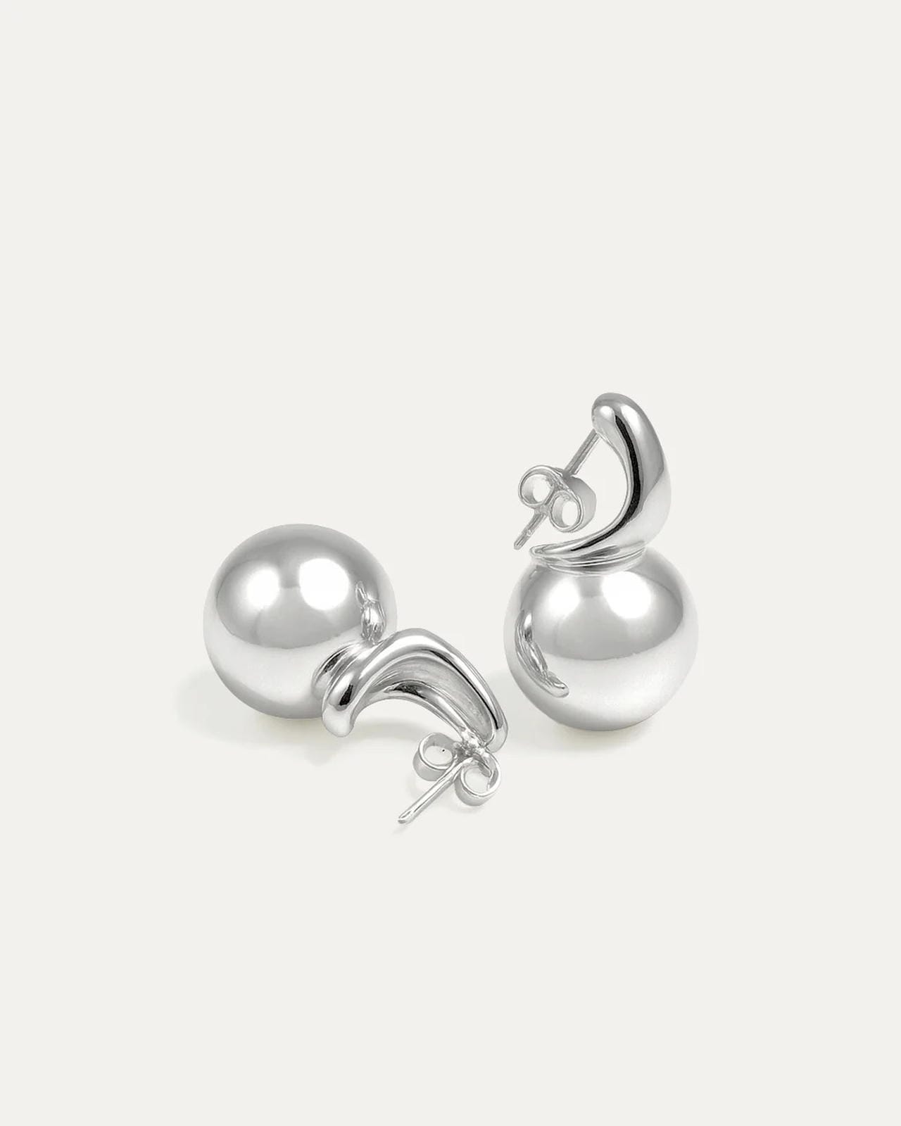 Pair of silver earrings on a white background