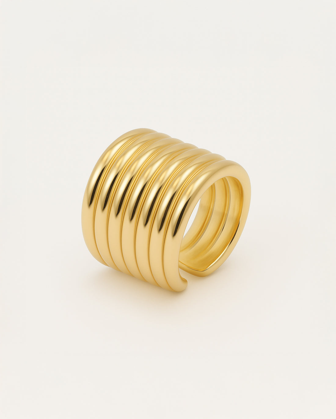 Gold statement ring with wide grooved band design