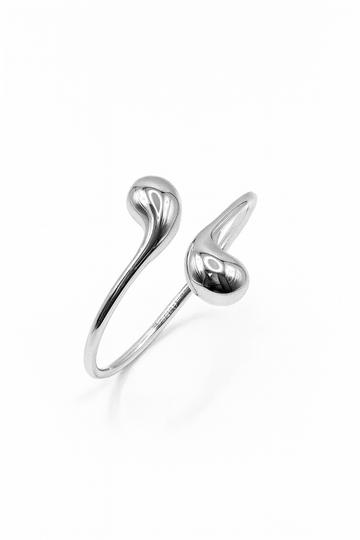 Eclipse Drop Cuff in silver-plated brass with double droplet ends and a polished sculptural finish
