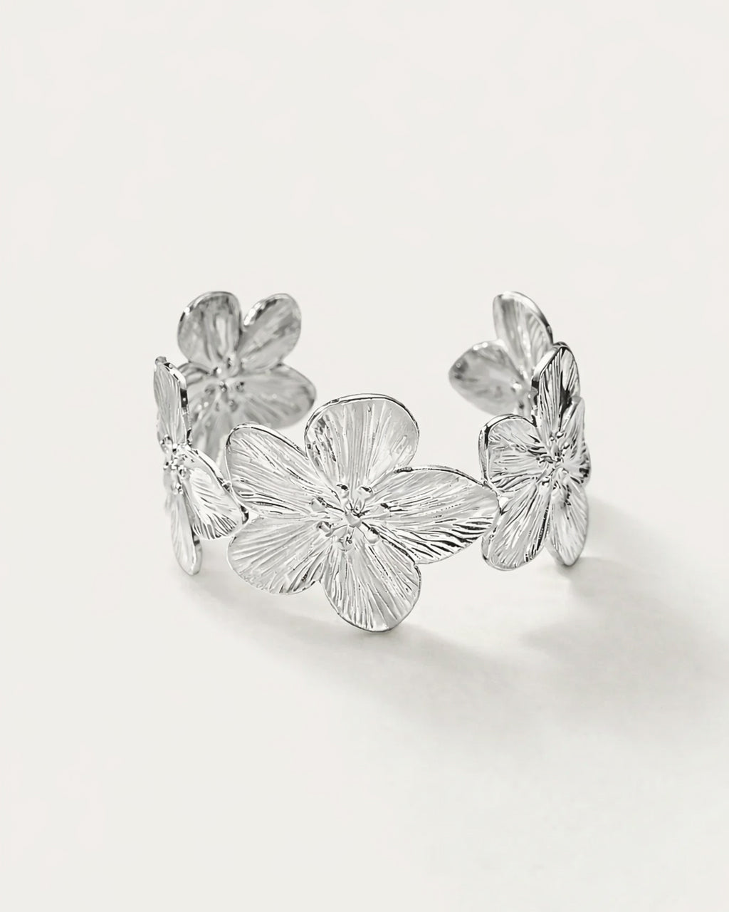 Silver floral cuff bracelet with sculpted flowers, statement bangle for women