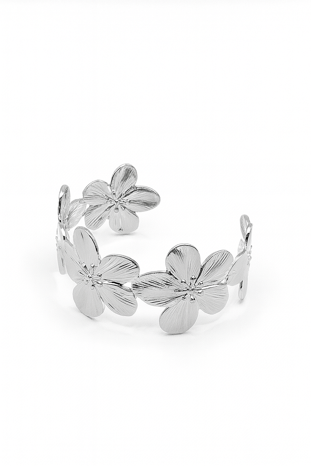 Flora Bloom Cuff in silver-plated brass featuring detailed flower motifs in an open cuff design