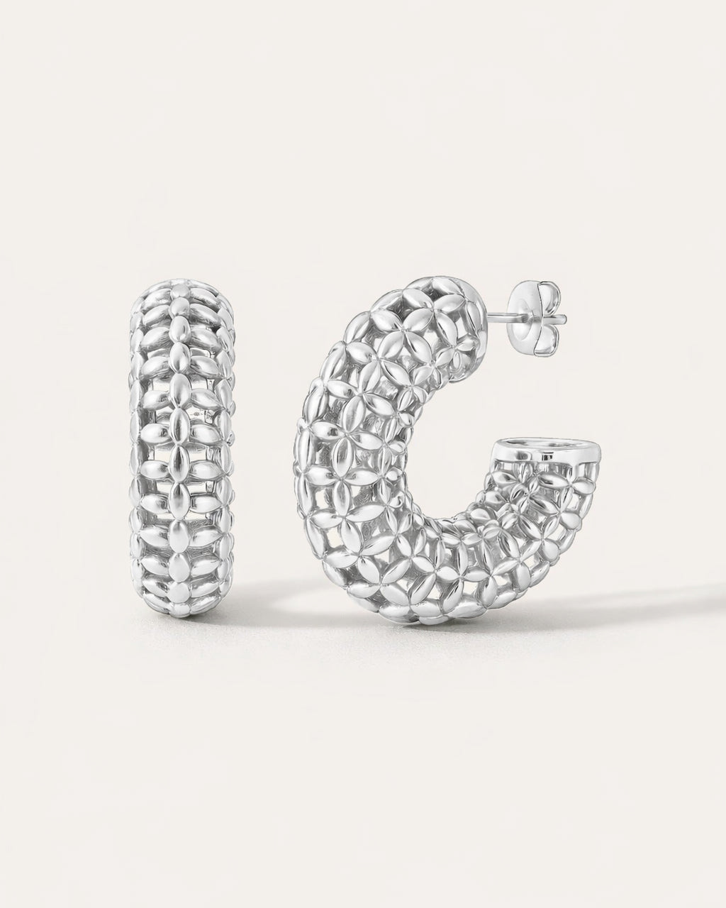 Silver-plated floral lattice hoop earrings with textured petal-inspired design, modern sculptural style by Jadejuri