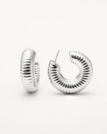 Silver grooved dome hoop earrings with ribbed texture and polished silver-plated finish