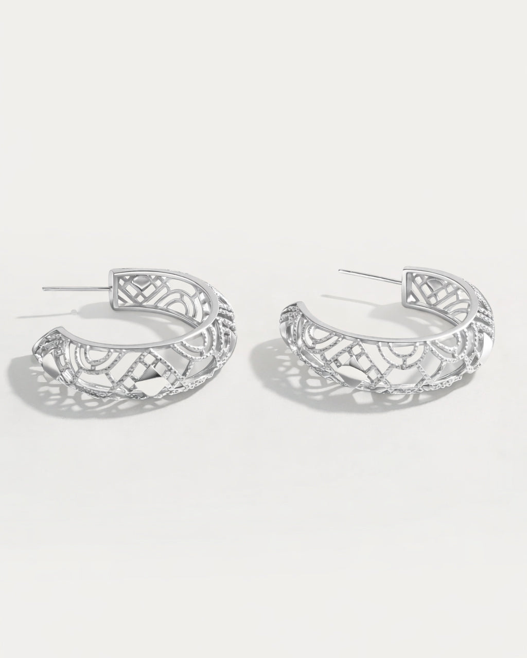Silver lattice hoop earrings with openwork geometric pattern and polished silver finish