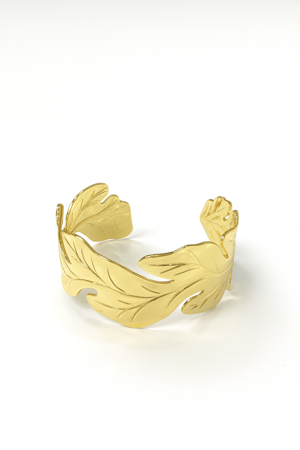 18K gold-plated brass cuff bracelet with bold leaf-inspired open design on white background