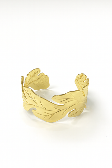 18K gold-plated brass cuff bracelet with bold leaf-inspired open design on white background
