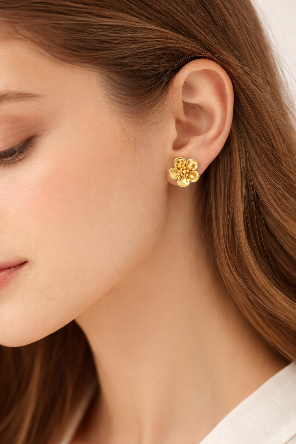18K gold-plated lily flower stud earrings with sculpted petals and polished floral design