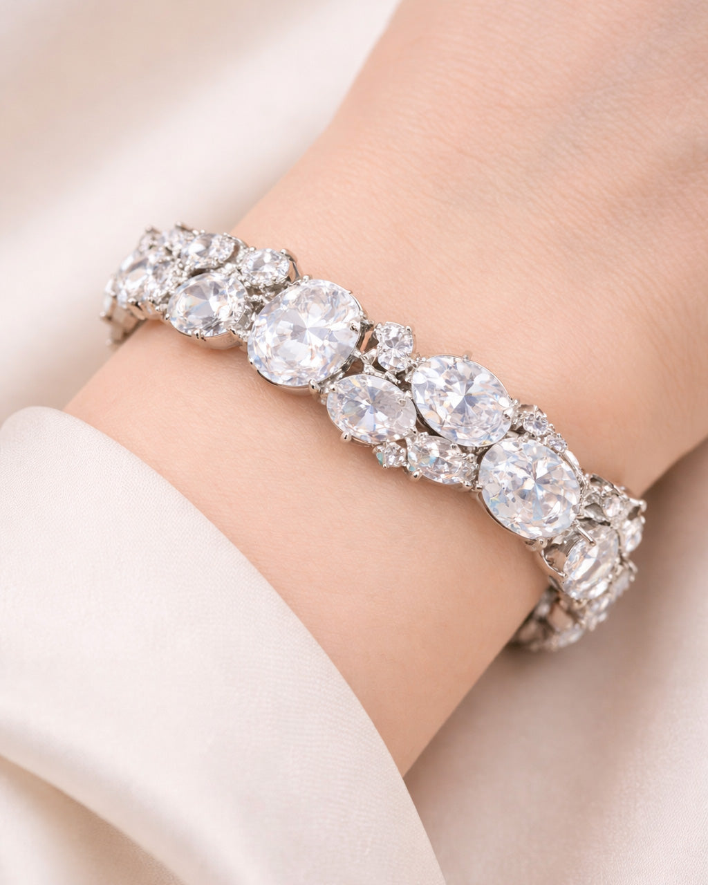 Oval CZ tennis bracelet in silver plated finish, worn on wrist lifestyle view