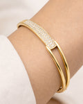 Close-up on wrist gold-plated pavé crystal bangle bracelet for women 