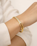 On-wrist gold-plated pavé bangle bracelet, minimalist style for women | Jadejuri