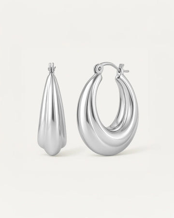 silver-plated luna curve hoop earrings, smooth sculptural crescent design with polished finish