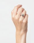 Model wearing silver-plated dome ring with polished spherical design, minimalist statement ring on hand