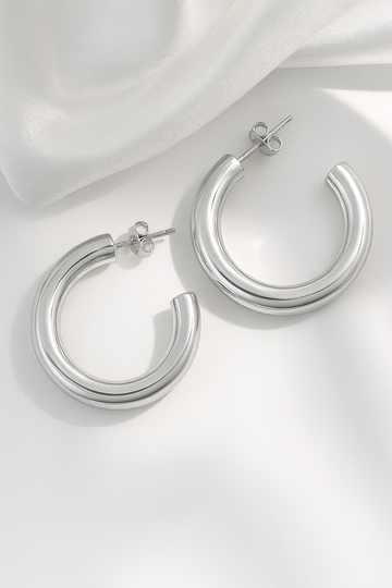silver-plated bold hoop earrings with chunky modern design on white background
