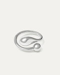 A sleek, polished silver open-cuff ring featuring a fluid, minimalist design. The ring wraps around, terminating in two contr