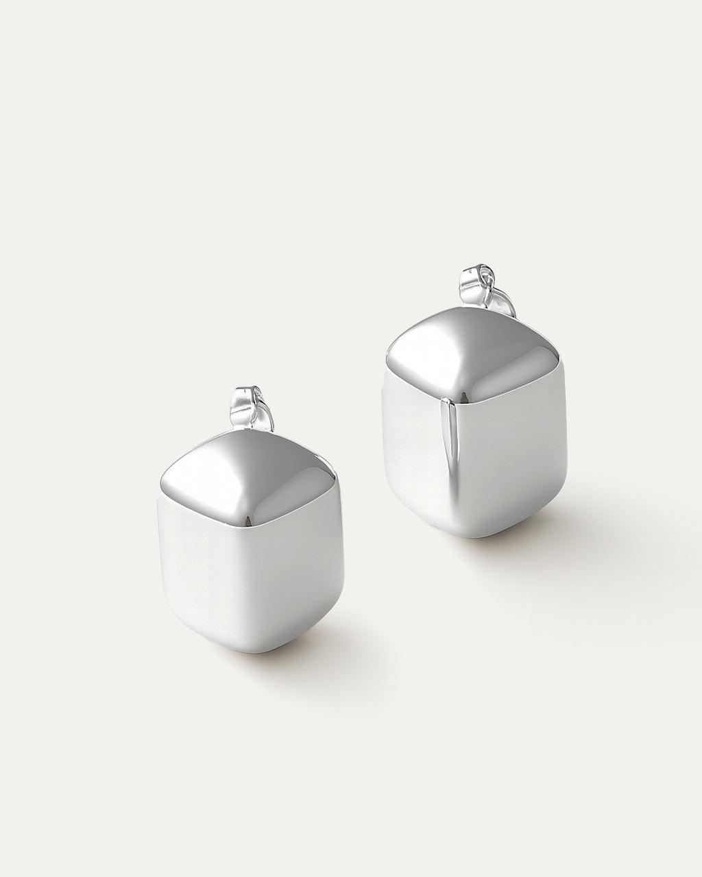 Silver-plated brass dome-shaped stud earrings with high-polish finish on neutral background