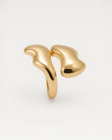 Gold statement ring with fluid melted design and open-front structure