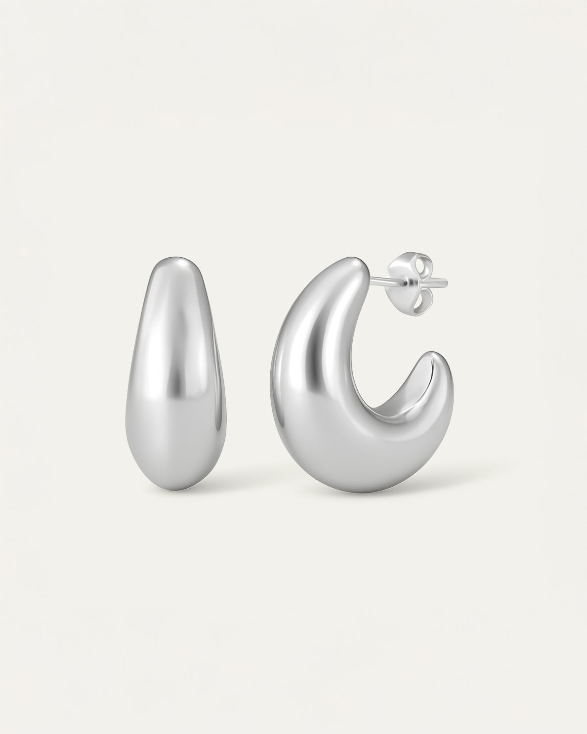Pair of silver hoop earrings on a light gray background