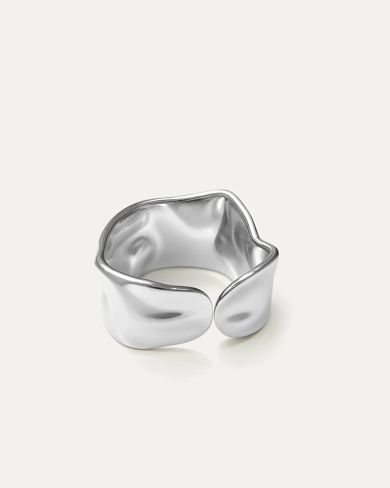 silver-plated ring with molten wave design and open back on white background