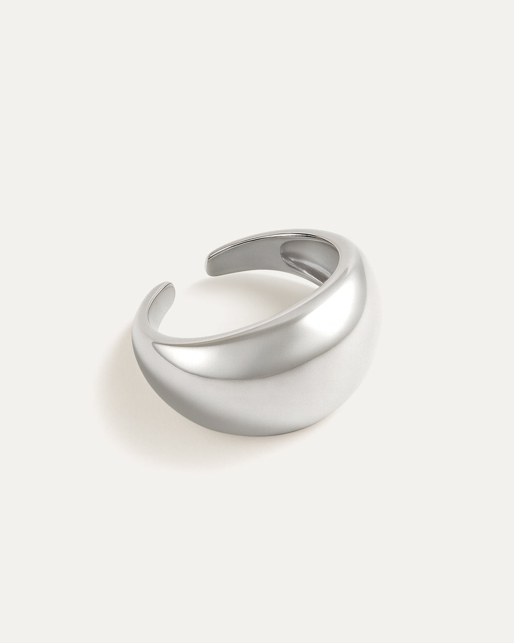 moon shaped silver ring grey background