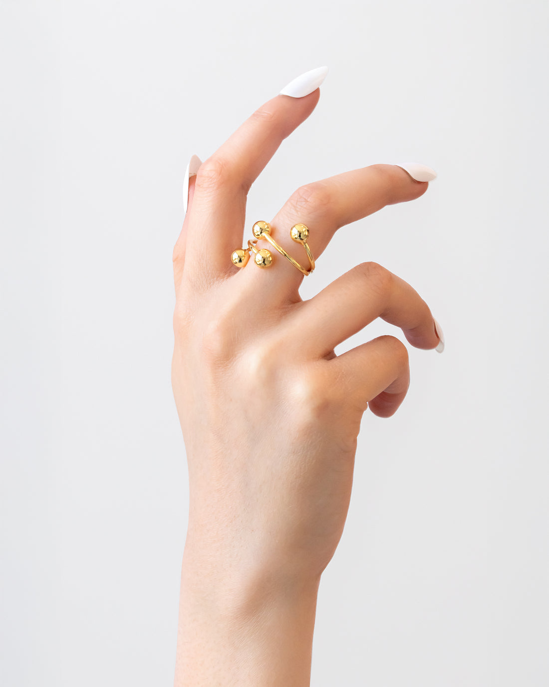 Orbit Cluster Ring in polished gold with four spherical orbs – Jadejuri