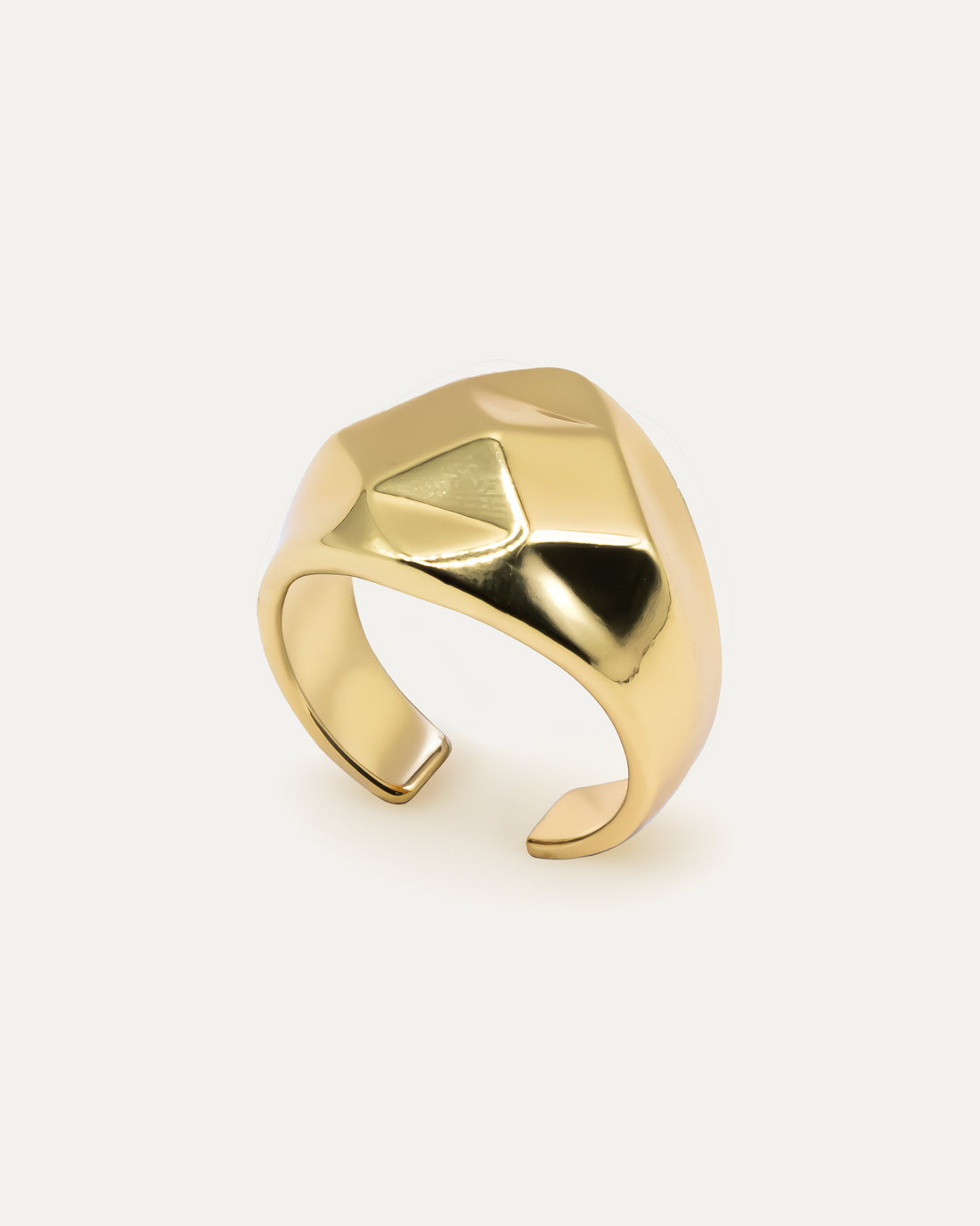 Minimalist gold signet ring with smooth pyramid relief on a polished band