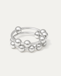 silver-plated sculptural ring with double bands and polished ball accents on white background
