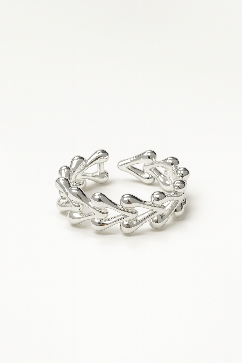 delicate silver ring with teardrop vine design on white background