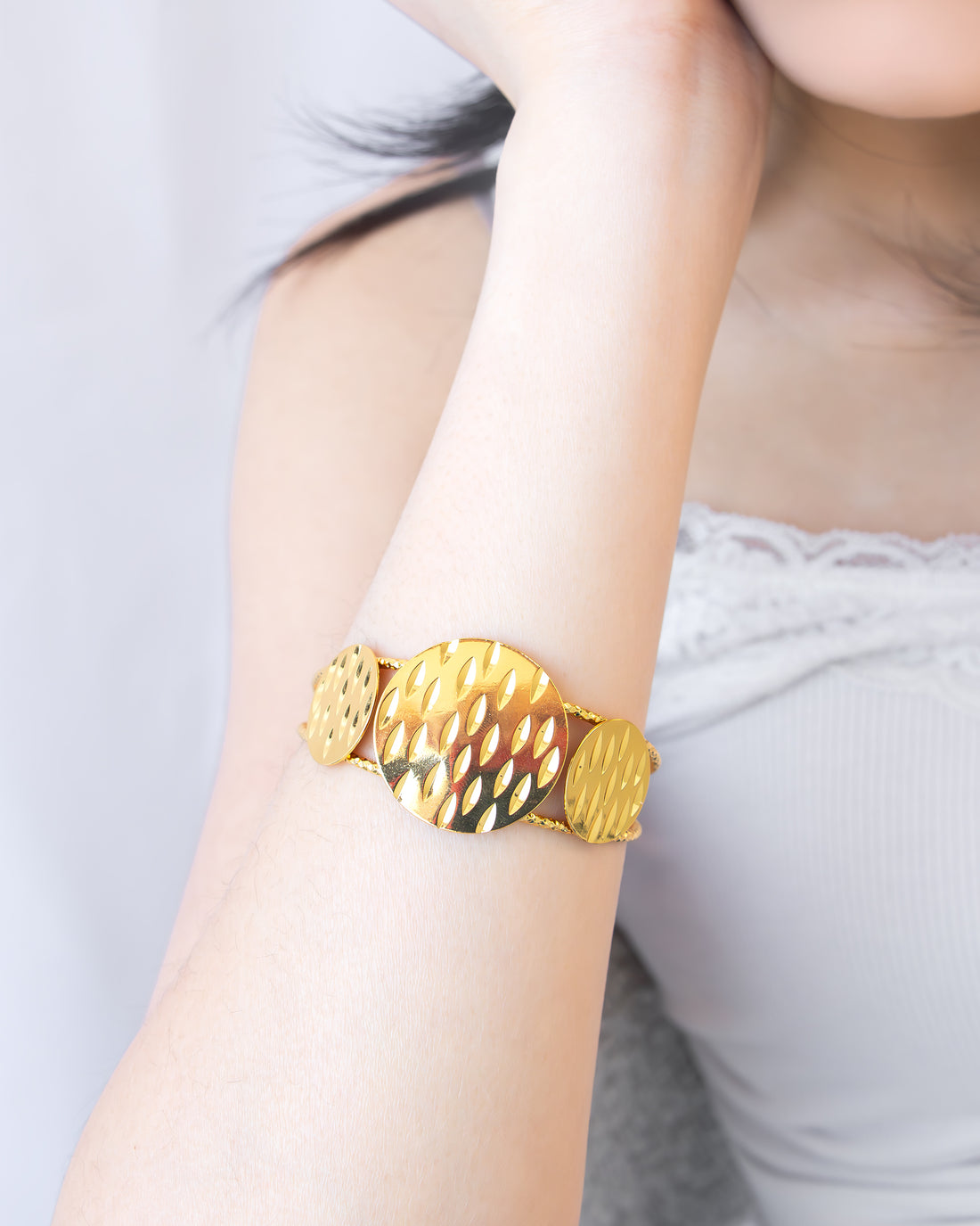 Ripple Gleam Cuff Bracelet in hammered gold finish on wrist – Jadejuri