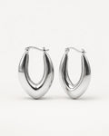 Silver sculpted hoop earrings with a marquise-inspired shape, featuring a polished minimalist design by Jadejuri