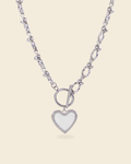 Silver necklace with textured chain and white heart enamel pendant – toggle clasp design with pavé detailing.