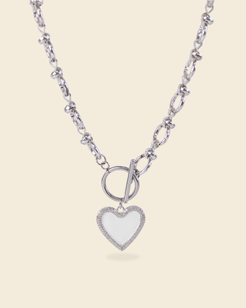 Silver necklace with textured chain and white heart enamel pendant – toggle clasp design with pavé detailing.