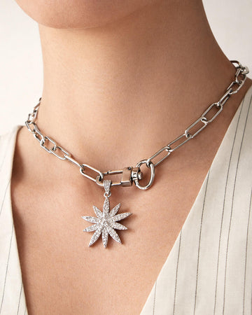 18k gold-plated starburst lock choker necklace worn on model, bold chain choker with star pendant