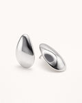 Silver sculpted teardrop stud earrings top view, featuring a smooth polished minimalist design by Jadejuri