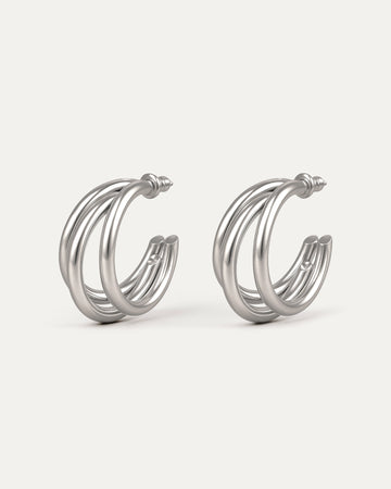 Silver-plated brass triple C-shaped hoop earrings with sleek modern design on white background