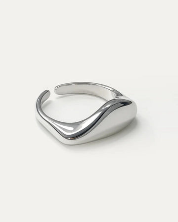 Wavecrest Ring – adjustable silver-plated brass minimalist ring by Jadejuri, sleek sculpted wave-inspired design.